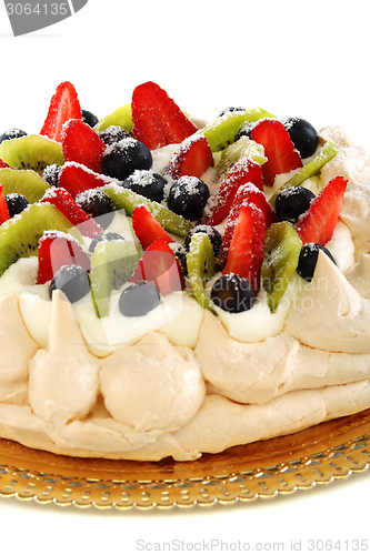 Image of Pavlova dessert with berries closeup.
