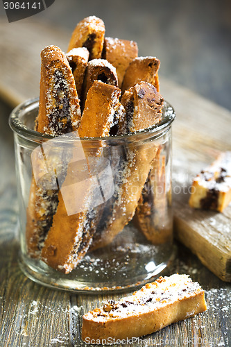 Image of Biscotti with chocolate in a glass jar.