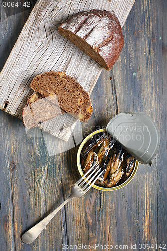 Image of Snack - sprats and bread.