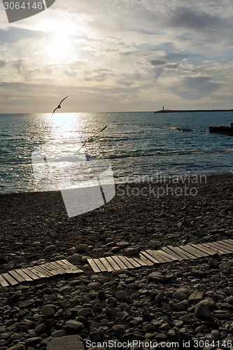 Image of Sunset on a deserted beach.