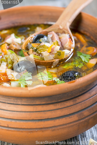 Image of Thick meat soup in a ceramic pot.