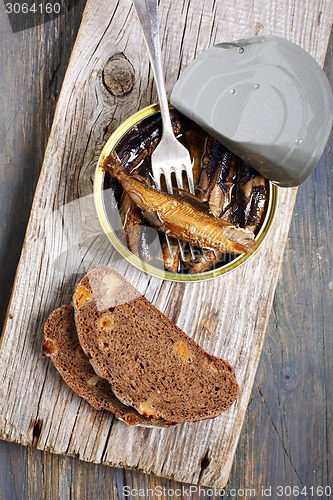 Image of Sprats in a tin and fork.