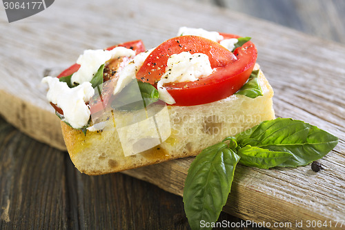 Image of Tomatoes, mozzarella and basil on ciabatta.