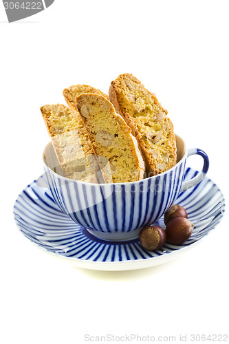 Image of Biscotti in striped teacup.