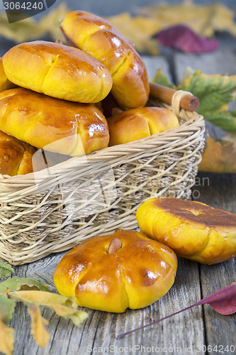 Image of Basket with pumpkin buns.