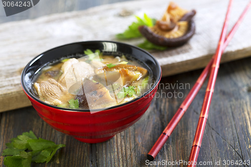 Image of Miso soup with duck breast closeup.