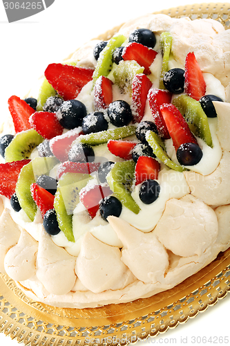 Image of Meringue with whipped cream and berries.