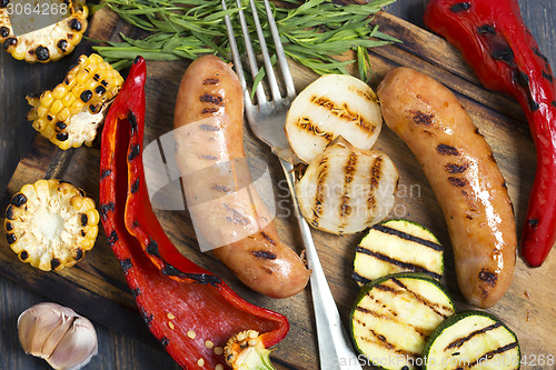 Image of Sausages and grilled vegetables closeup.