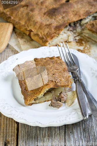 Image of Pie with meat and potatoes.