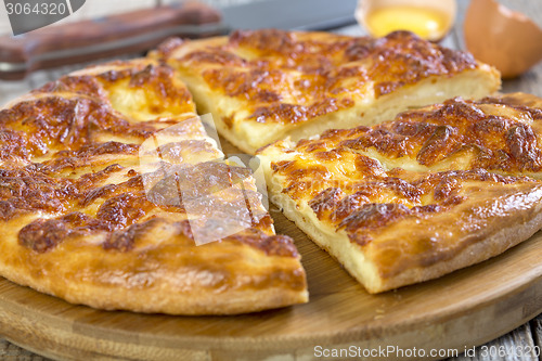 Image of Slices of pie with cheese closeup. 