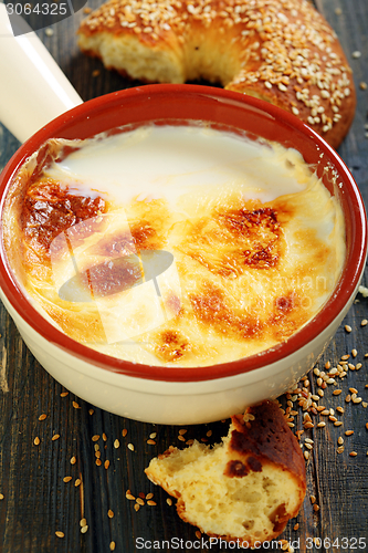 Image of Homemade fermented baked milk and bagel with sesame seeds.