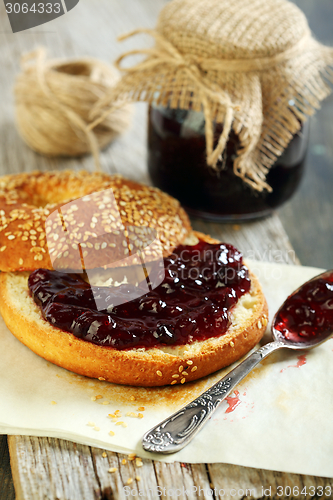 Image of Homemade bagel with jam for breakfast.