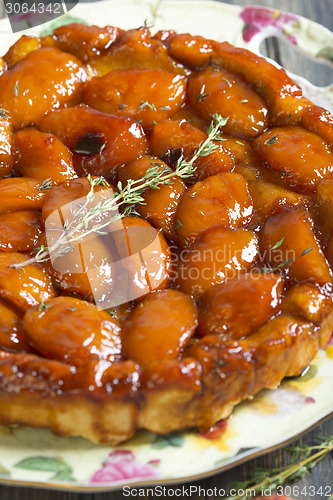 Image of Tarte Tatin with peaches and thyme.