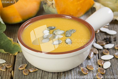 Image of Pumpkin soup with seeds closeup.