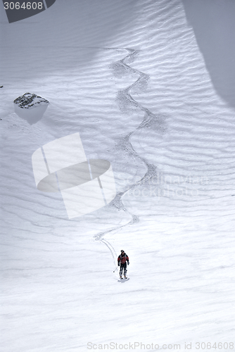 Image of Male skier riding down the hill