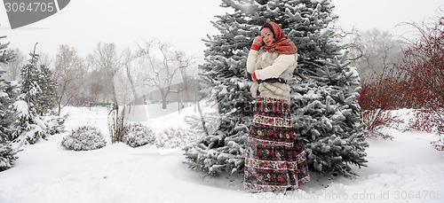 Image of Young Russian woman in winter park