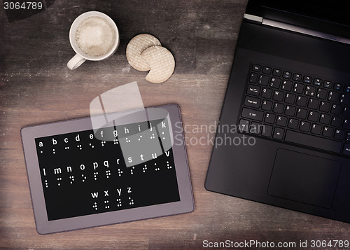 Image of Braille on a tablet, concept of impossibility