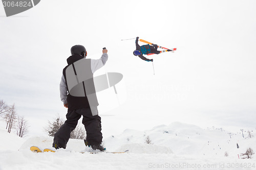 Image of Free style skier performing a high jump