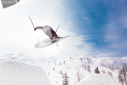 Image of Free style skier performing a high jump