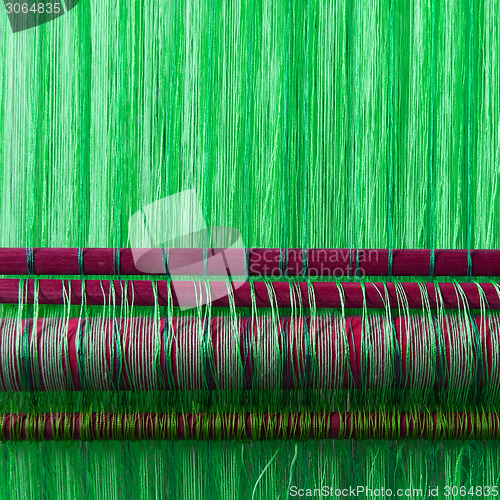 Image of Handmade silk textile industry, silk scarf on a old machine