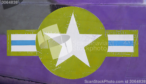 Image of Tail of Vietnam war Airplane, green and purple