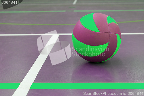 Image of Green and purple ball on court at break time