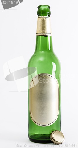Image of empty green beer bottle with crown seal