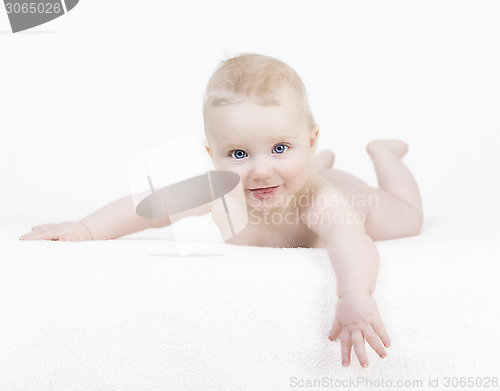 Image of baby naked in front of a white background