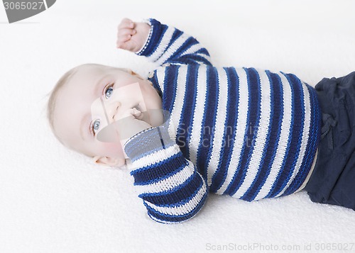 Image of baby lying on his back