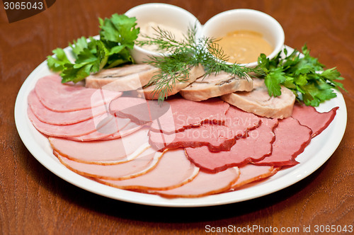 Image of meat, ham and sauce