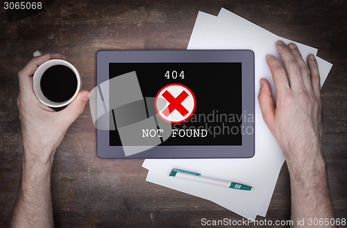 Image of Tablet displaying an error, 404