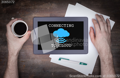 Image of Cloud-computing connection on a digital tablet pc