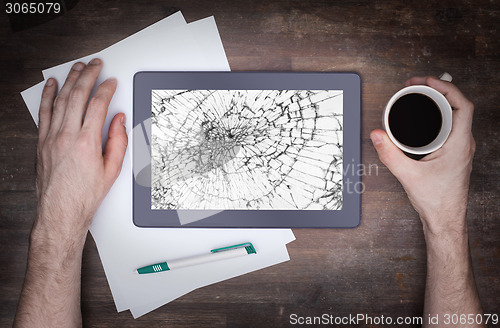 Image of Tablet computer with broken glass