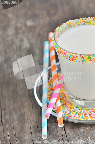 Image of Glass of milk with striped straws