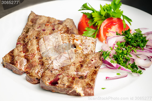 Image of fried beef liver with vegetables