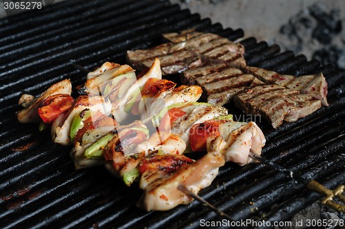 Image of chicken meat skewers with peppers