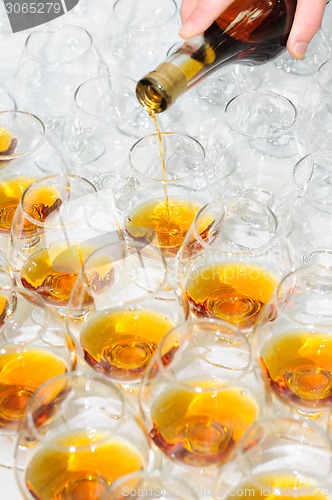 Image of pouring the brandy or cognac