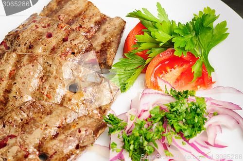 Image of fried beef liver with vegetables