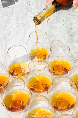 Image of pouring the brandy or cognac