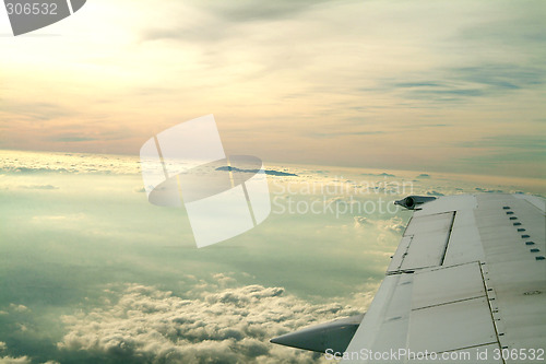 Image of wing of an airplane and sky