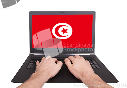 Image of Hands working on laptop, Tunisia