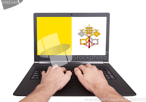 Image of Hands working on laptop, Vatican City