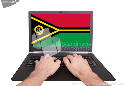 Image of Hands working on laptop, Vanuatu