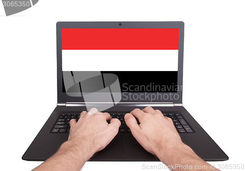 Image of Hands working on laptop, Yemen