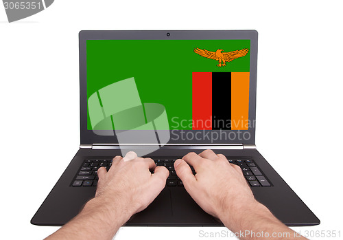 Image of Hands working on laptop, Zambia