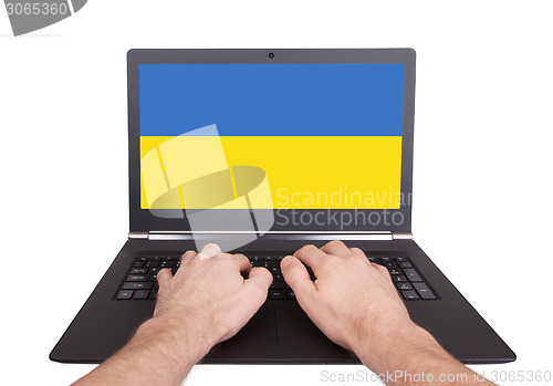 Image of Hands working on laptop, Ukraine
