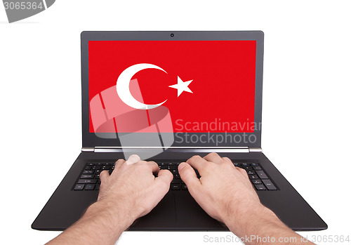 Image of Hands working on laptop, Turkey