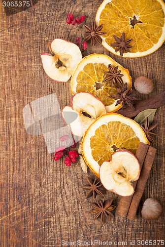 Image of Christmas spices and dried orange sliceson 