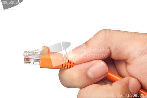 Image of Hand plugging a network cable