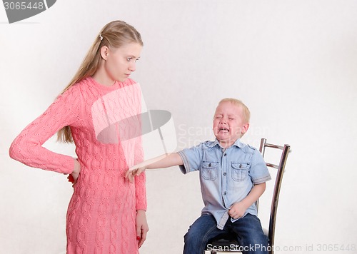 Image of Young mother took the child's toy